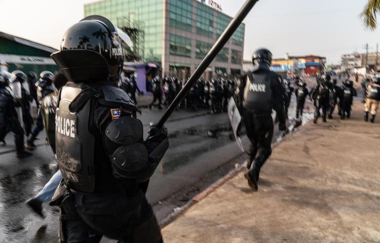 Police are seen in Monrovia, Liberia, on January 6, 2020. Security forces recently harassed and attacked at least four journalists in Liberia. (AFP/Carielle Doe)