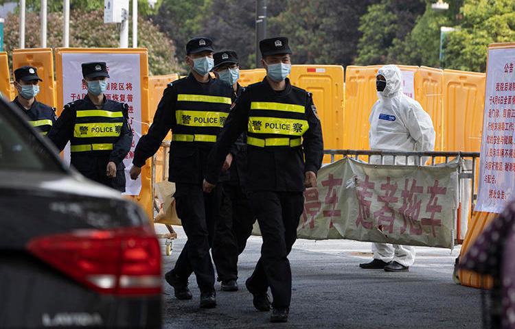 Police officers are seen in Wuhan, China, on April 4, 2020. (AP/Ng Han Guan)