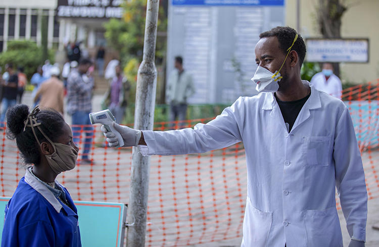 People have their temperatures checked at the Zewditu Memorial Hospital in Addis Ababa, Ethiopia, on March 18, 2020. Journalist Yayesew Shimelis was recently detained over a report about the pandemic. (AP/Mulugeta Ayene)