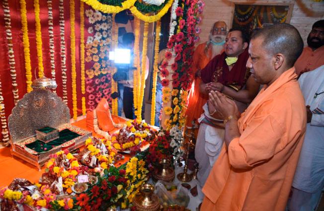 Chief Minister of Uttar Pradesh state Yogi Adityanath prays in Ayodhya, India, on March 25, 2020. Police in the state launched a criminal investigation into the editor of The Wire for his reporting on the ceremony. (AP/Amar Kumar)