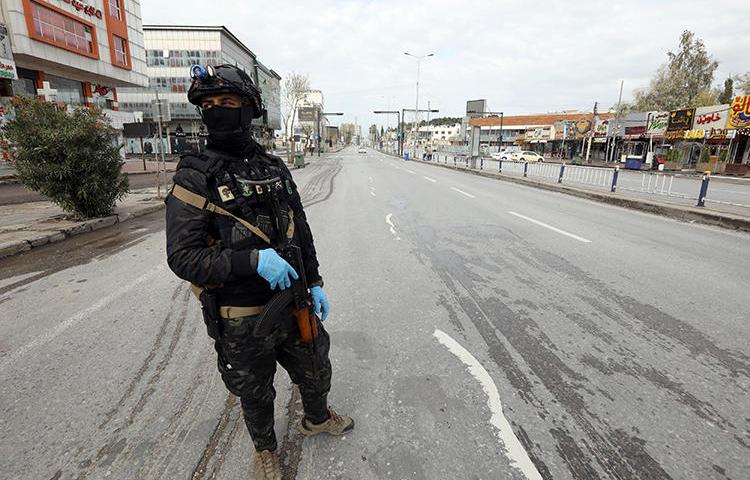 A security officer is seen in Sulaimaniya, Iraqi Kurdistan, on March 14, 2020. Kurdish Iraqi journalist Amanj Warte recently received anonymous threats. (Reuters/Ako Rasheed)