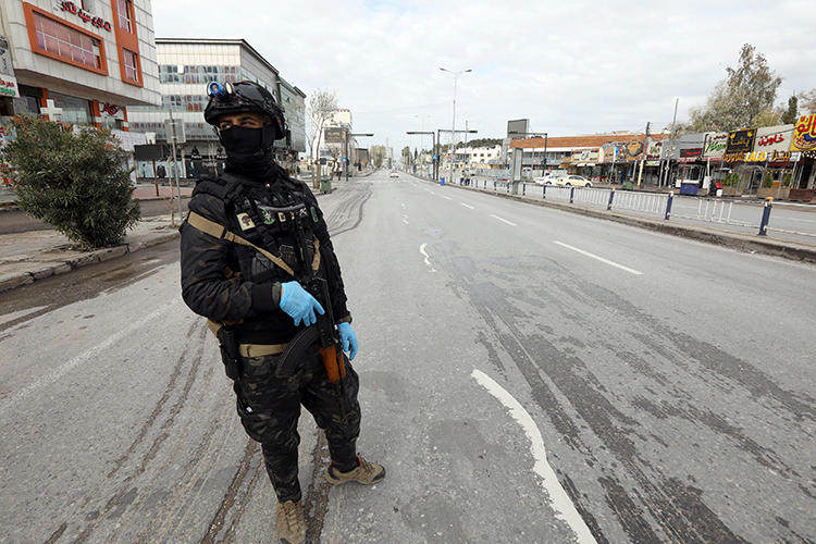 A security officer is seen in Sulaimaniya, Iraqi Kurdistan, on March 14, 2020. Kurdish Iraqi journalist Amanj Warte recently received anonymous threats. (Reuters/Ako Rasheed)