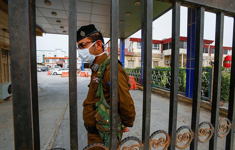 A security officer is seen in Najaf, Iraq, on February 24, 2020. Najaf-based reporter Ali al-Haj was recently threatened over his reporting. (Reuters/Alaa al-Marjani)