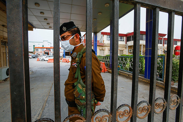 A security officer is seen in Najaf, Iraq, on February 24, 2020. Najaf-based reporter Ali al-Haj was recently threatened over his reporting. (Reuters/Alaa al-Marjani)