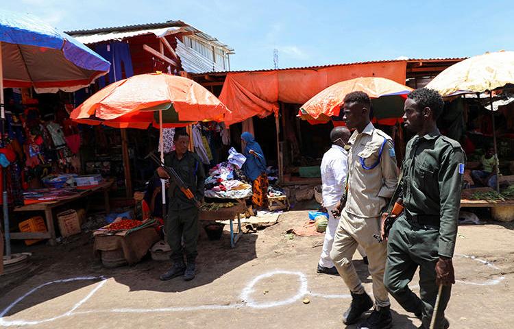 Police officers are seen in Mogadishu, Somalia, on April 16, 2020. Somali authorities have been holding journalist Mohamed Abdiwahab Nuur incommunicado since early March. (Reuters/Feisal Omar)