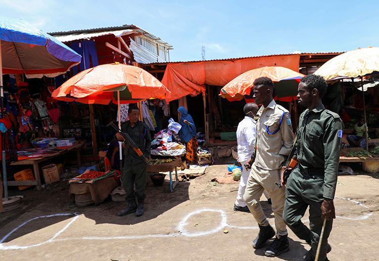 Police officers are seen in Mogadishu, Somalia, on April 16, 2020. Somali authorities have been holding journalist Mohamed Abdiwahab Nuur incommunicado since early March. (Reuters/Feisal Omar)