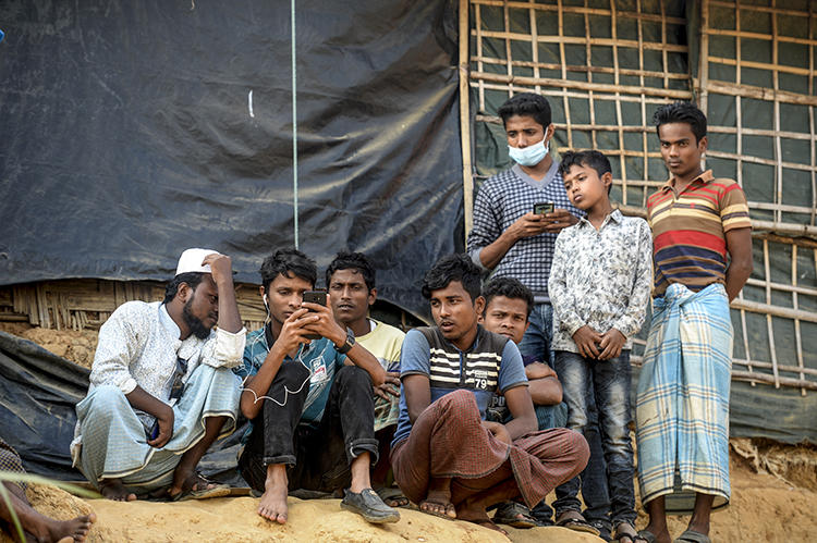 Rohingya refugees are seen in a camp in Cox's Bazar, Bangladesh, on December 11, 2019. CPJ recently spoke with refugee and journalist Ro Sawyeddollah about working in the camp. (AFP/Munir Uz Zamin)