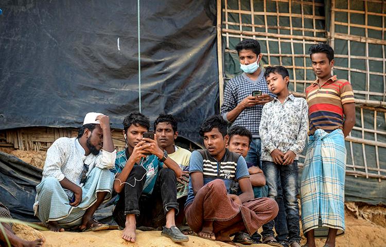 Rohingya refugees are seen in a camp in Cox's Bazar, Bangladesh, on December 11, 2019. CPJ recently spoke with refugee and journalist Ro Sawyeddollah about working in the camp. (AFP/Munir Uz Zamin)