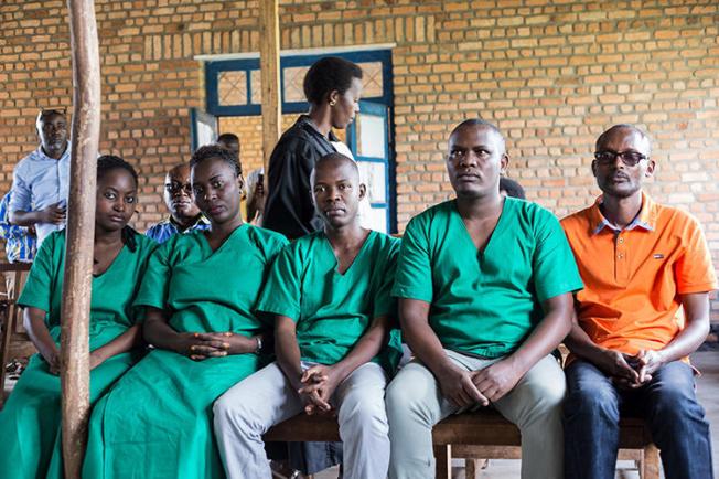 Four Iwacu journalists, (L to R) Agnes Ndirubusa, Christine Kamikazi, Egide Harerimana, Terence Mpozenzi, and the driver Adolphe Masabarakiza, appear at the High Court in Bubanza, western Burundi, on December 30, 2019. The journalists plan to appeal their sentence. (AFP/Tchandrou Nitanga)