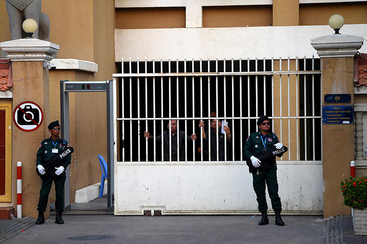 Police officers are seen in Phnom Penh, Cambodia, on January 22, 2020. Authorities recently charged journalist Sok Oudom with incitement. (AFP/Tang Chhin Sothy)