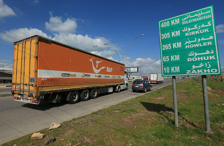 A truck leaves Ibrahim Al-Khalil complex to a warehouse in Zakho outskirts, following the outbreak of COVID-19, in Dohuk province, Iraqi Kurdistan, on April 2, 2020. On May 16, security forces in Iraqi Kurdistan detained 8 journalists in Duhok covering a protest, and charged 4. (Reuters/Ari Jalal)