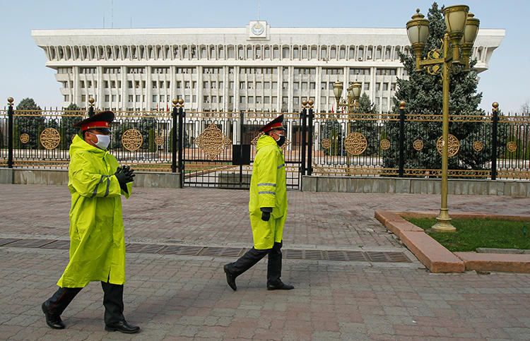 Law enforcement officers are seen in Bishkek, Kyrgyzstan, on March 26, 2020. CPJ recently joined a letter expressing concern over media restrictions in the country. (Reuters/Vladimir Pirogov)