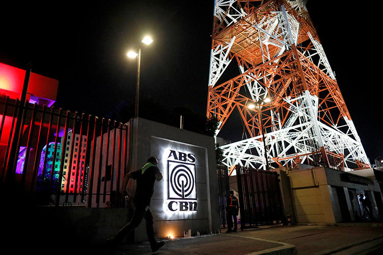 The ABS-CBN network headquarters, where candles are lit following government orders to cease its operations, is seen in Quezon City, Metro Manila, Philippines, on May 5, 2020. (AP/Eloisa Lopez)