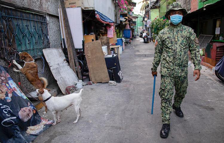 A police officer is seen in Manila, the Philippines, on April 24, 2020. Philippine reporter Rex Cornelio Pepino was recently shot and killed. (Reuters/Eloisa Lopez)