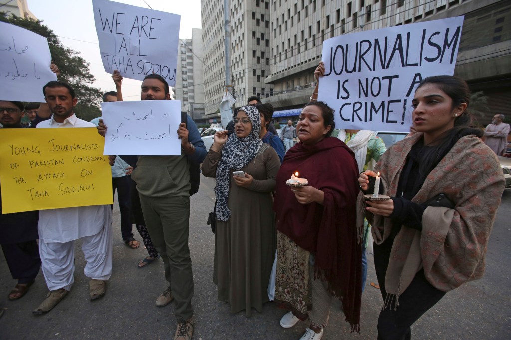 Protestors holding signs