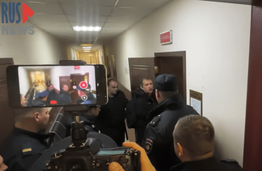 RusNews reporter Roman Ivanov walks into a court in Korolyov, Russia on April 12, 2023. The court ordered he be detained until June 10 on three charges of spreading fake information about the Russian army.