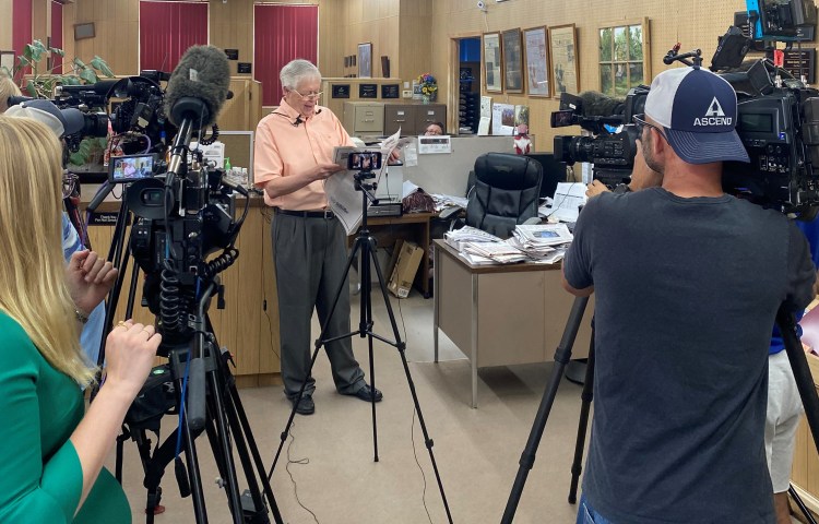 Marion County Record owner and editor Eric Meyer holds a freshly printed edition of the newspaper on August 16, 2023, as he addresses an impromptu press conference for reporters in Marion to cover the aftermath of a police raid on the publication five days earlier. (Photo: Katherine Jacobsen)