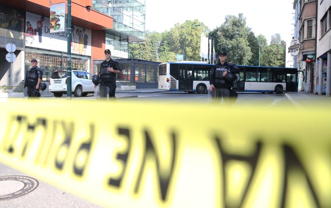 Special Police officers stand on a road they have sealed off with yellow tape in Sarajevo, Bosnia and Herzegovina, on September 8, 2019.