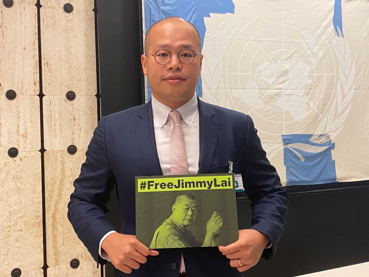 Sebastien Lai, son of Hong Kong media tycoon Jimmy Lai, holds a sign calling for the release of his father on the sidelines of the United Nations Human Rights Council in Geneva, Switzerland, September 27, 2023.