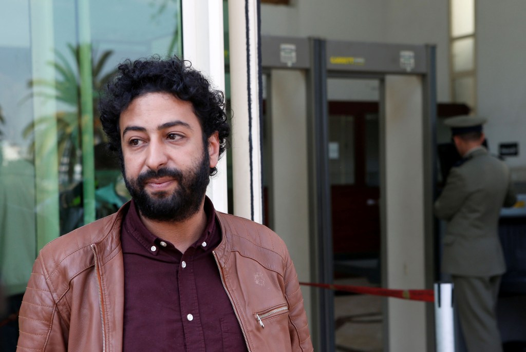 Journalist and activist Omar Radi waits outside court in Casablanca, Morocco, on March 12, 2020.