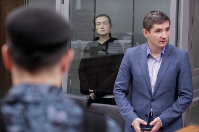 Russian-American journalist for Radio Free Europe/Radio Liberty (RFE/RL) Alsu Kurmasheva, who is in custody after she was accused of violating Russia's law on foreign agents, stands inside an enclosure for defendants as she attends a court hearing in Kazan, Russia, December 1, 2023. (Reuters/Alexey Nasyrov)