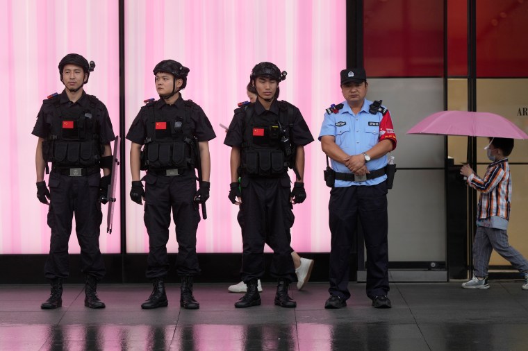 Chinese police officers outside West Lake in Hangzhou, China, on September 22, 2023.