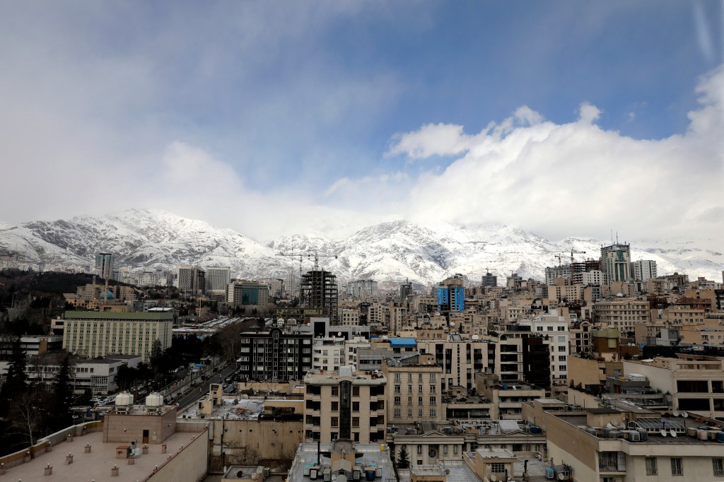 A view of Iran's capital, Tehran, with the snow-covered Alborz mountain range in the background on February 5, 2024.