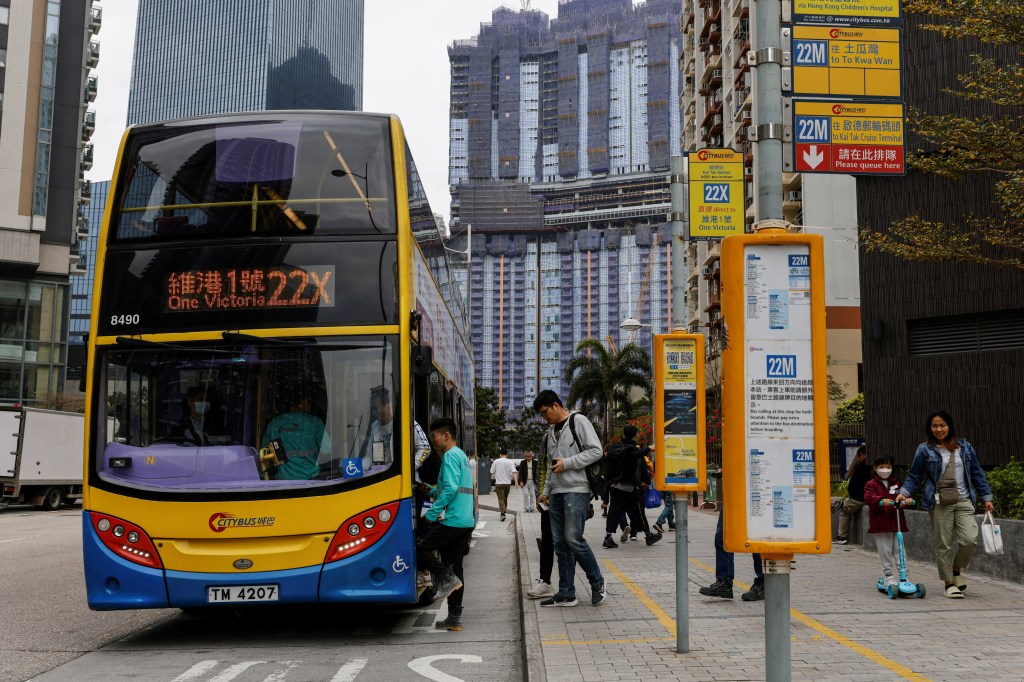 People board a bus in Hong Kong, China, on February 27, 2024.