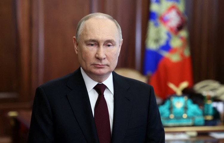 Russian President Vladimir Putin makes a video address in Moscow ahead of the upcoming presidential election, in a picture released on March 14, 2024.