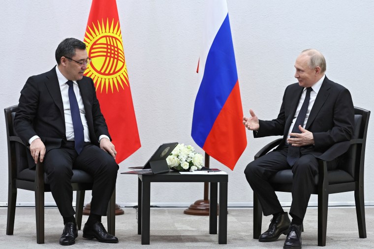 Kyrgyz President Sadyr Japarov (left) speaks to Russian President Vladimir Putin in Kazan, the capital of Republic of Tatarstan, Russia, on February 21, 2024. CPJ called for Kyrgyzstan to repeal a law ratified by President Japarov requiring some nonprofits, including media organizations, to register as “foreign representatives” on April 2, 2024. (Photo: Sputnik and Kremlin Pool Photo via AP/Sergei Bobylev)