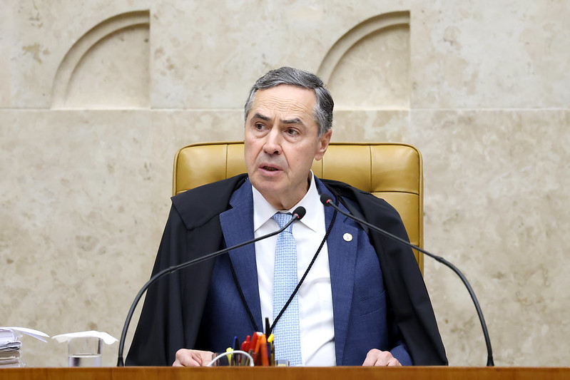 Luís Roberto Barroso, president of the Brazilian Supreme Court, listens to proceedings on May 22, when the court recognized the judicial harassment of journalists.