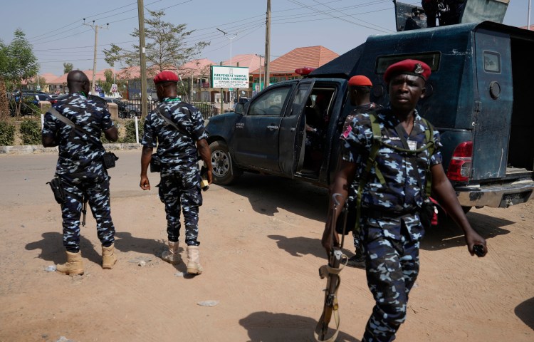 Four police officers on patrol in Nigeria in 2023.