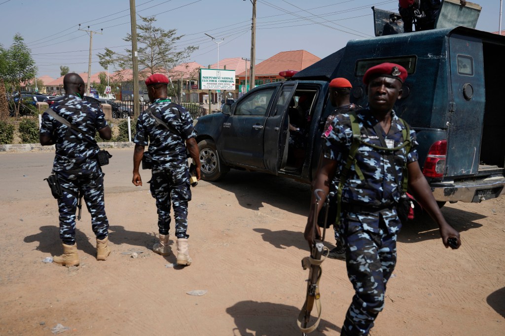 Four police officers on patrol in Nigeria in 2023.