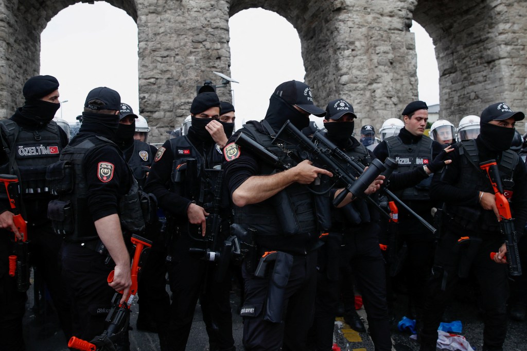 Turkish police officers block a main road to prevent May Day demonstrators from marching through Taksim Square, a famous square banned for May Day celebrations, in Istanbul, Turkey May 1, 2024.