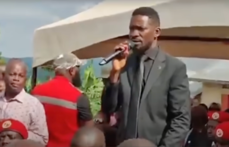 On May 18, Ugandan journalists Zainab Namusaazi, Gertrude Mutyaba, and Magaret Kayondo said that opposition leader Robert Kyagulanyi Ssentamu's private bodyguards harassed and assaulted them while they were covering the funeral of a prominent businessman in the central region district of Lwengo. Ssentamu, pictured here, spoke at the funeral. (Screenshot: Daily Monitor/YouTube)