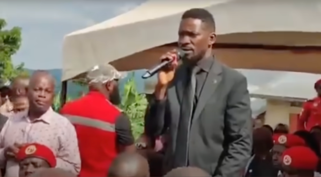 On May 18, Ugandan journalists Zainab Namusaazi, Gertrude Mutyaba, and Magaret Kayondo said that opposition leader Robert Kyagulanyi Ssentamu's private bodyguards harassed and assaulted them while they were covering the funeral of a prominent businessman in the central region district of Lwengo. Ssentamu, pictured here, spoke at the funeral. (Screenshot: Daily Monitor/YouTube)