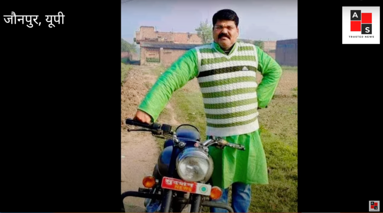 Indian journalist Ashutosh Srivastava standing with a motorbike.