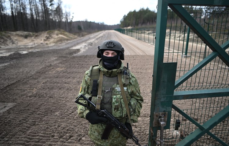 A Belarusian border guard patrols in the Brest region at the border with Ukraine in February 2023. On June 3, 2024, a court in the city of Brest convicted and sentenced journalist Alena Tsimashchuk to five years in prison but the grounds for her charges have not been disclosed. (Photo: AFP/Natalia Kolesnikova)