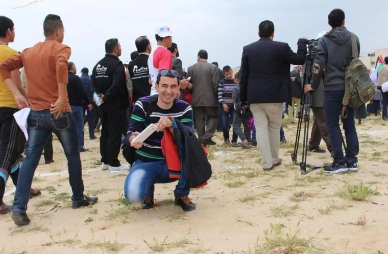 Palestinian journalist Abu Bakr Bashir covers a Japanese cultural event in Khan Yunis, Gaza, for Japan’s JIJI PRESS. (Photo: Courtesy of Abu Bakr Bashir)