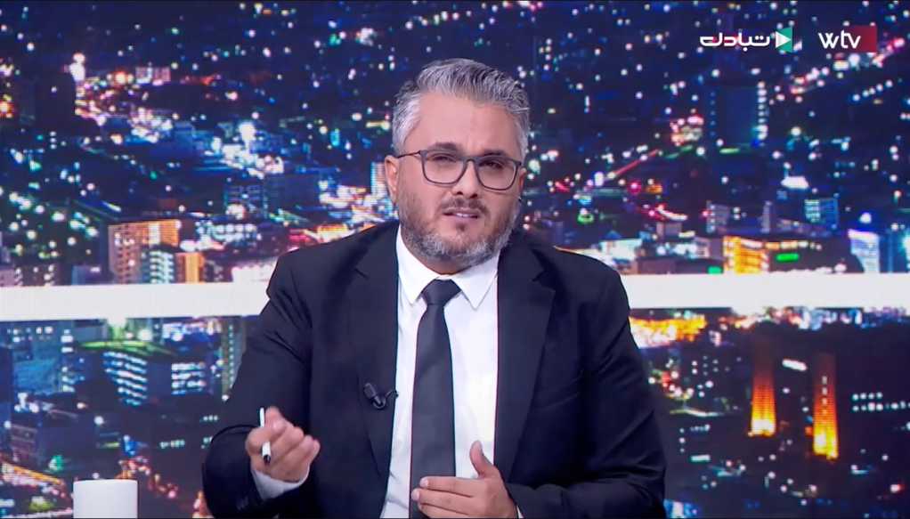 Libyan journalist Ahmed al-Sanussi speaking on Wasat TV.