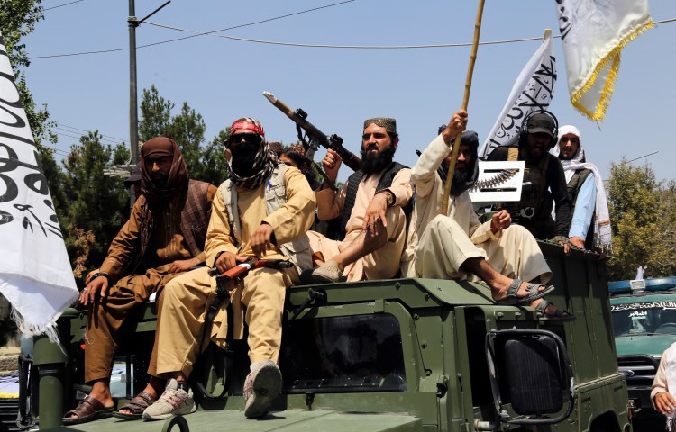 Taliban fighters celebrate the third anniversary of the withdrawal of US-led troops in Kabul, Afghanistan, on August 14, 2024.