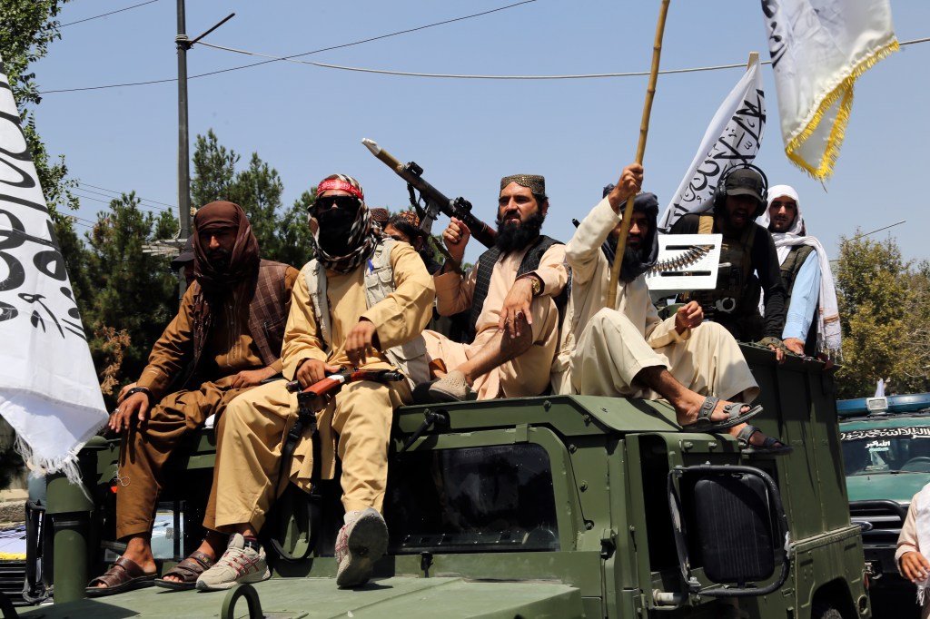 Taliban fighters celebrate the third anniversary of the withdrawal of US-led troops in Kabul, Afghanistan, on August 14, 2024.