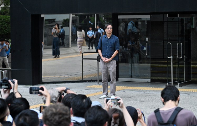 Chung Pui-kuen, the former chief editor of Hong Kong's now-shuttered outlet Stand News, walks outside on bail after he was found guilty in a landmark sedition trial under a colonial-era law, in Wanchai District Court in Hong Kong on August 29, 2024.