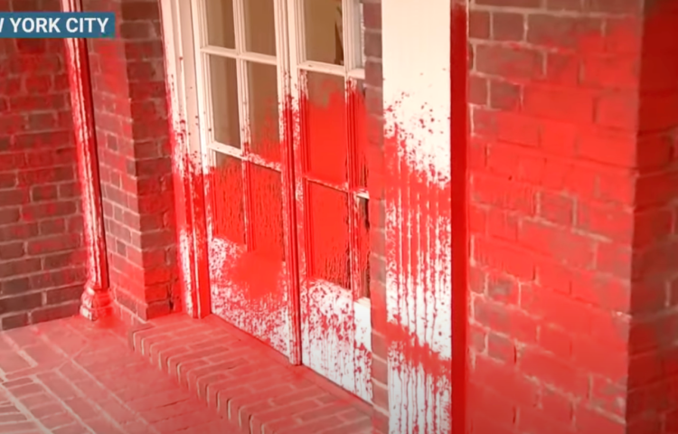 Red paint sprayed on the apartment building of Brooklyn Museum's Jewish director.