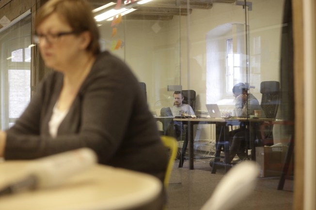 Journalists work in the office of Meduza in Riga, Latvia, in 2015.