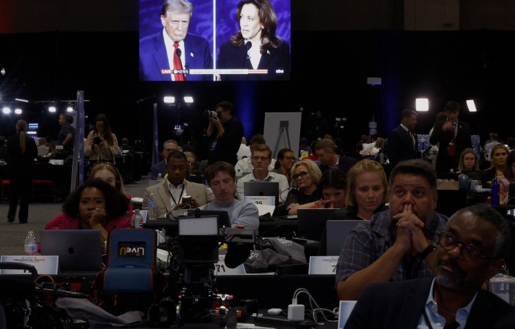 Journalists watch the televised debate between Republican presidential candidate Donald Trump and Democratic candidate Kamala Harris in Philadelphia on September 10, 2024. (Photo: Reuters/Evelyn Hockstein)