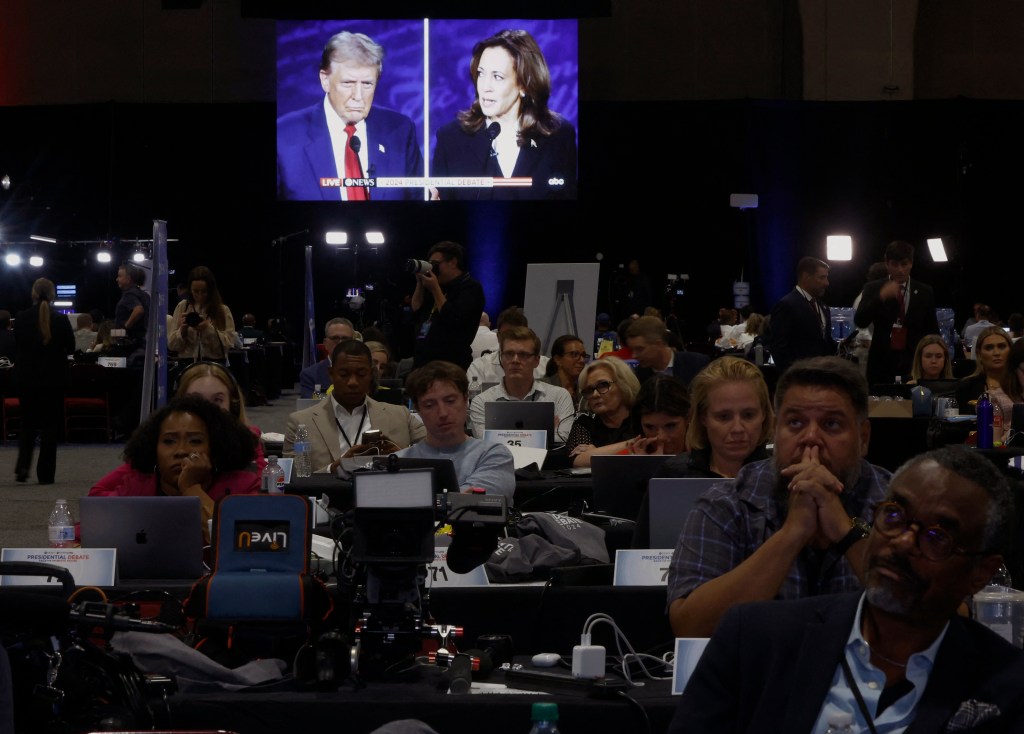 Journalists watch the televised debate between Republican presidential candidate Donald Trump and Democratic candidate Kamala Harris in Philadelphia on September 10, 2024. (Photo: Reuters/Evelyn Hockstein)