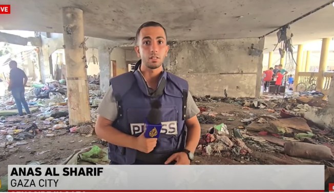 Al Jazeera's Anis Al Sharif reports from inside the school that was hit in an Israeli attack on August 10, 2024, killing more than 100 people. CPJ issued a statement expressing concern for his safety after the Israel Defense Forces accused him of "presenting a lie" in his coverae of the strike. https://cpj-preprod.go-vip.net/2024/08/cpj-concerned-about-safety-of-al-jazeera-gaza-correspondent-anas-al-sharif/ (Screenshot: YouTube/Al Jazeera)