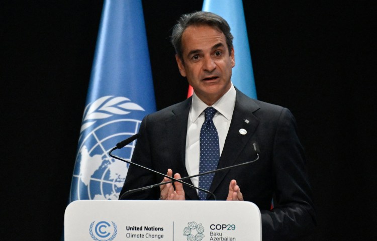 Greek Prime Minister Kyriakos Mitsotakis speaks during the United Nations Climate Change Conference in Baku on November 13, 2024. CPJ joined six other international press freedom organizations in condemning legal actions against Greek journalists filed by Grigoris Dimitriadis, former general secretary and the nephew of Mitsotakis. (Photo: AFP/Alexander Nemenov)