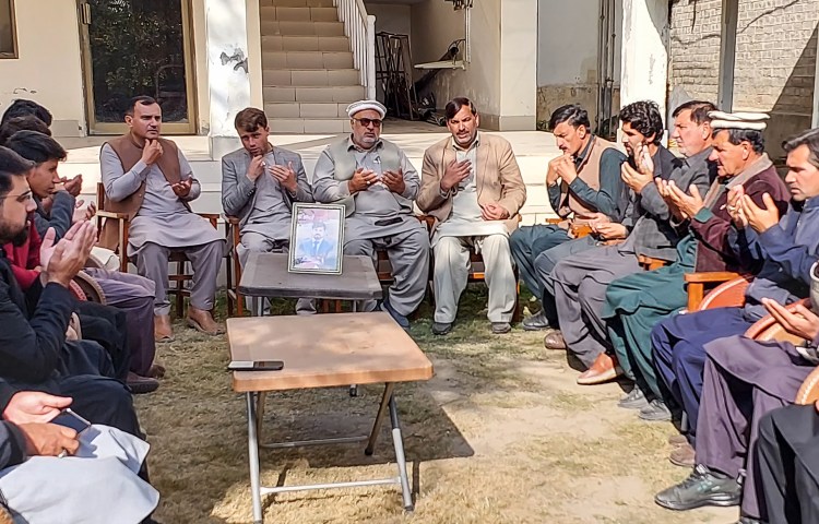 Local journalists pray for fellow journalist Janan Hussain, who was killed in a shooting in Kurram district on November 20, 2024. (Photo: AFP/Dilawer Khan)